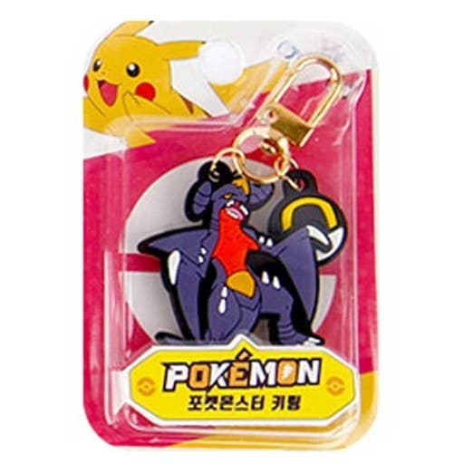 Pokémon keychain in packaging featuring garchomp on a white background